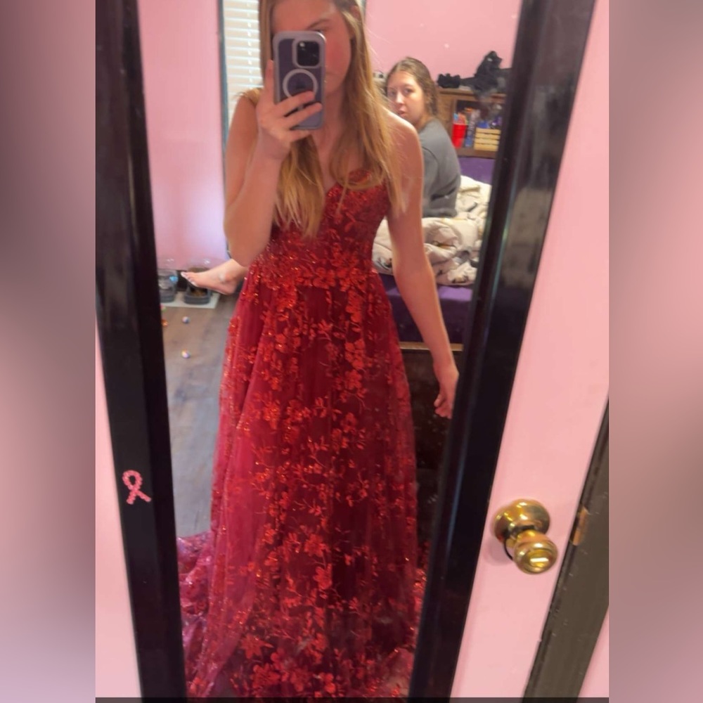 It is a red prom dress and this is the only one of its design.